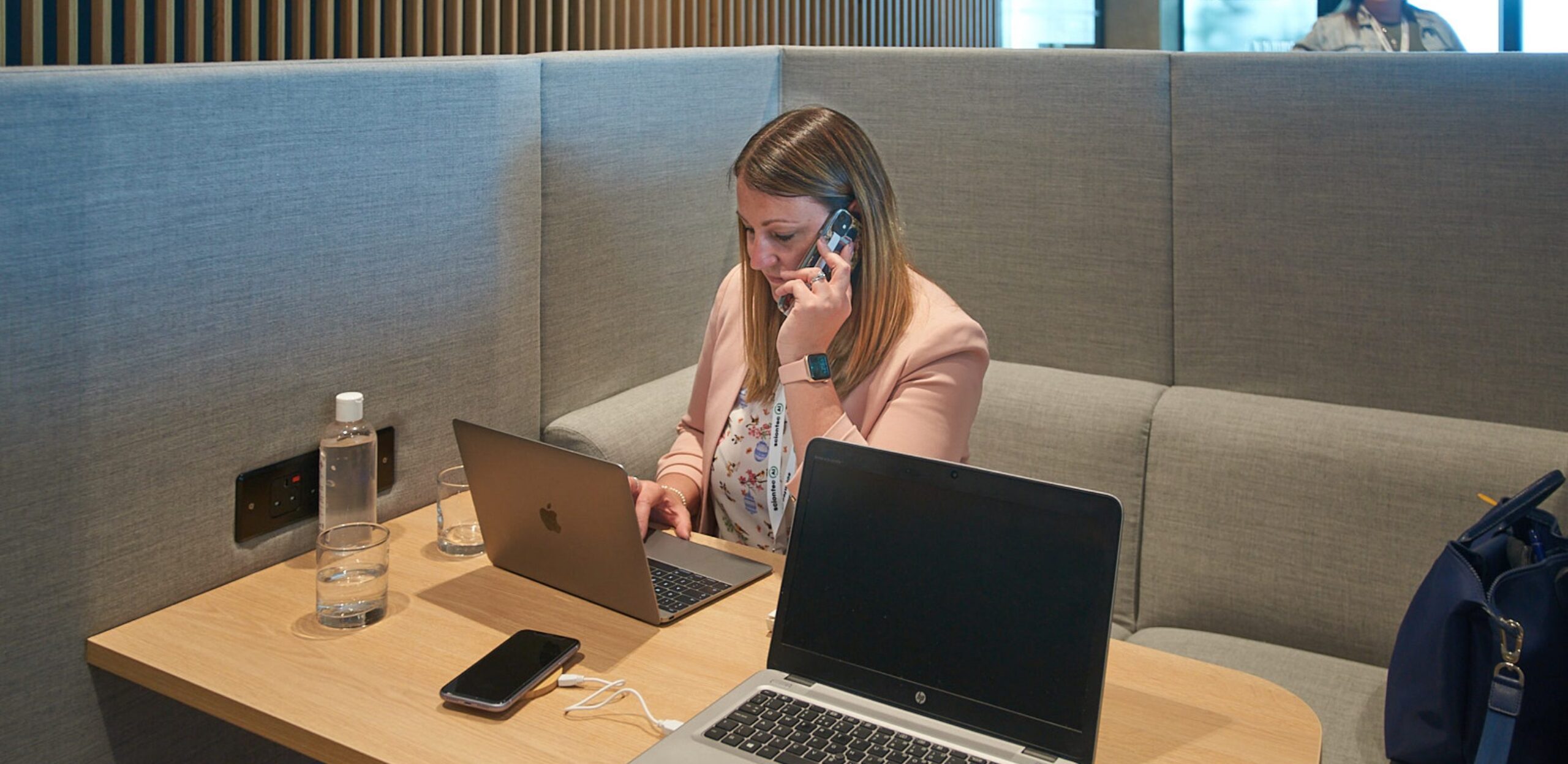 A woman on the phone in an office space