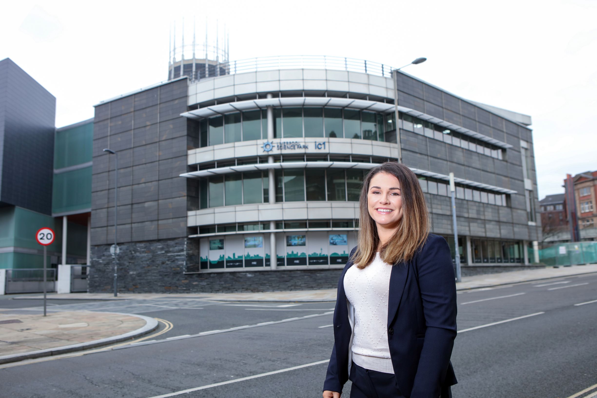 Dr Natalie Kenny stood in front of Liverpool Science Park