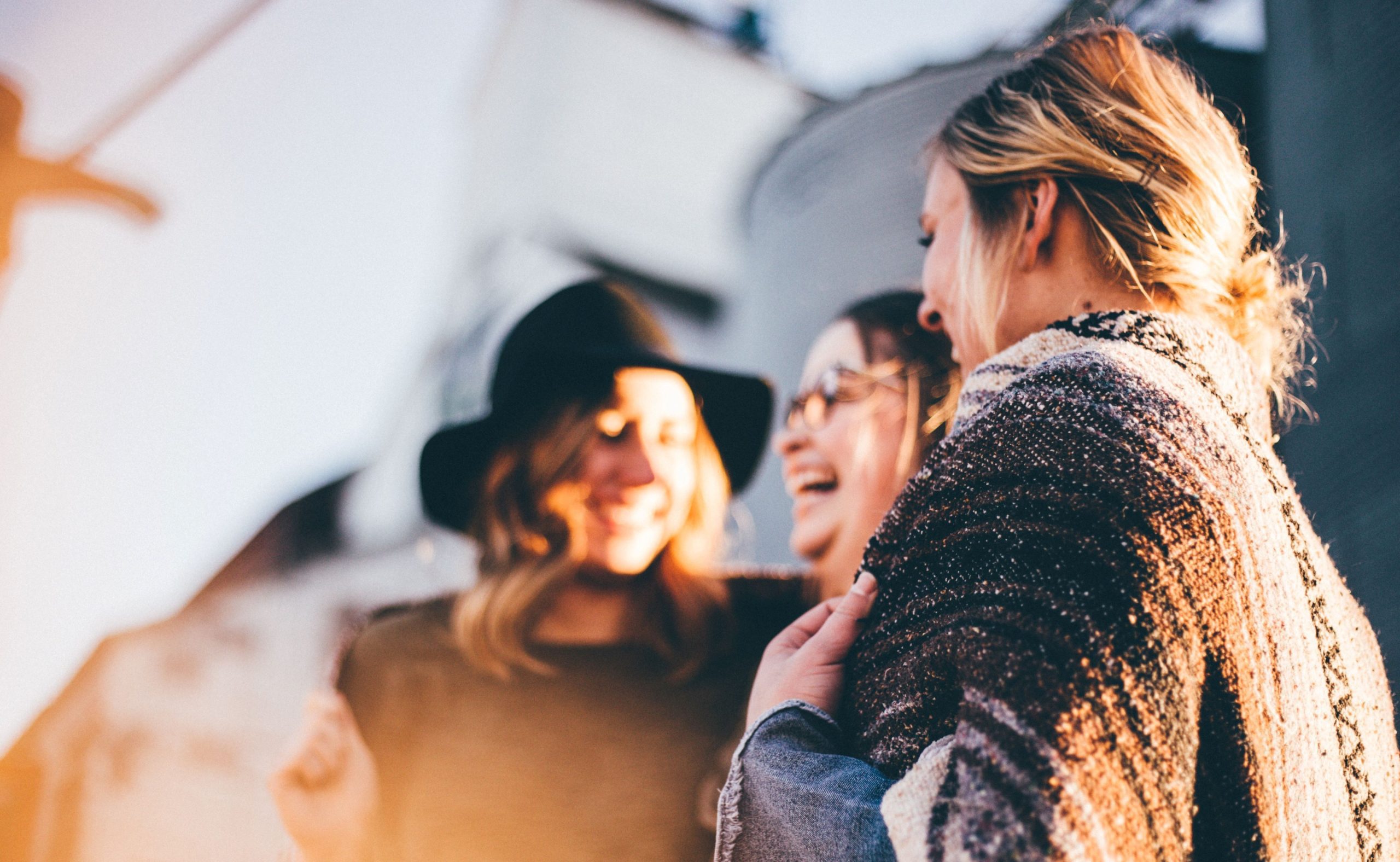 Three woman laughing together