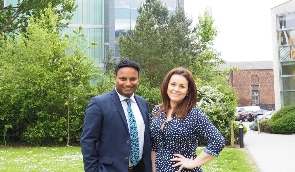 Faisal Arif and Dr Natalie Kenny stood in front of trees