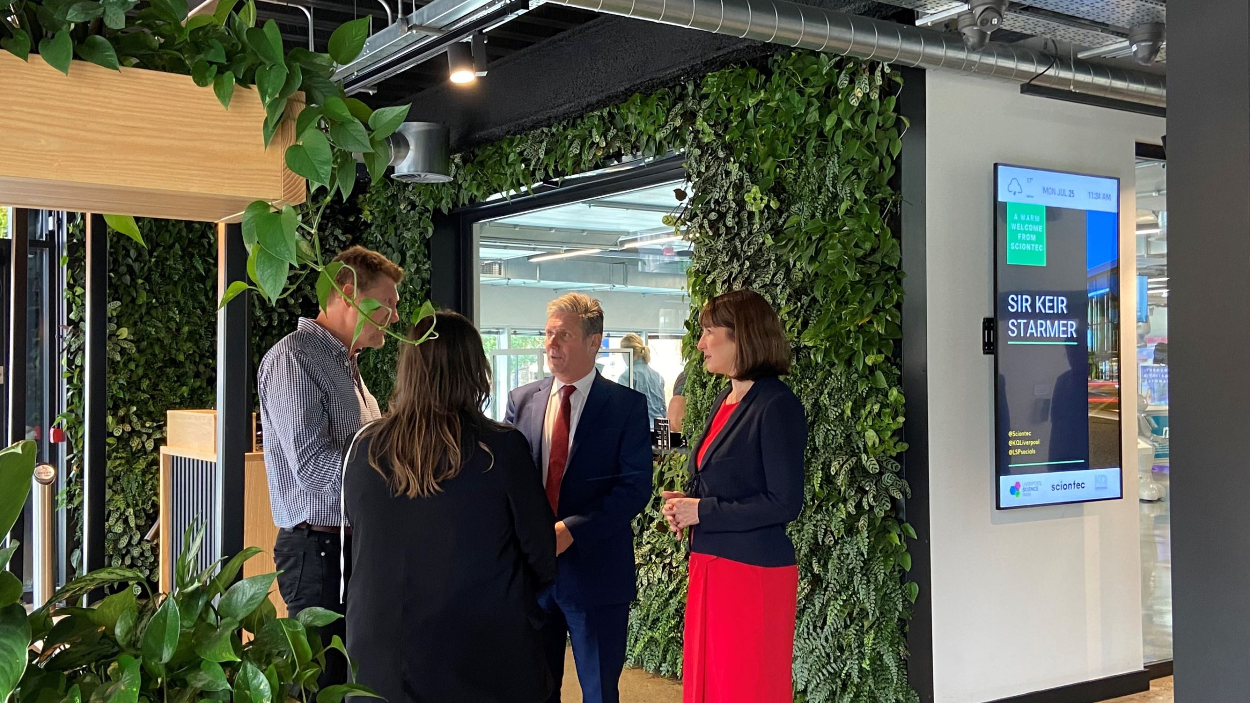 Sir Keir Starmer and three other people in one of the Liverpool Science Park buildings