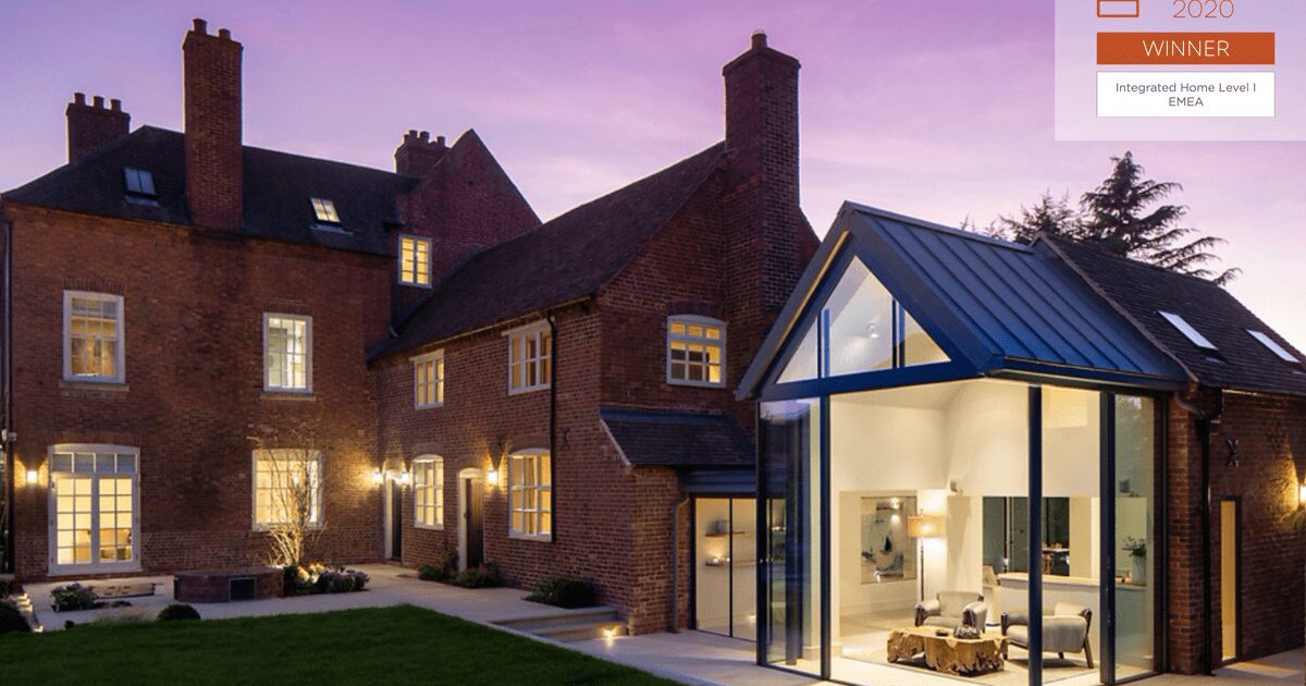 A large house with a glass extension