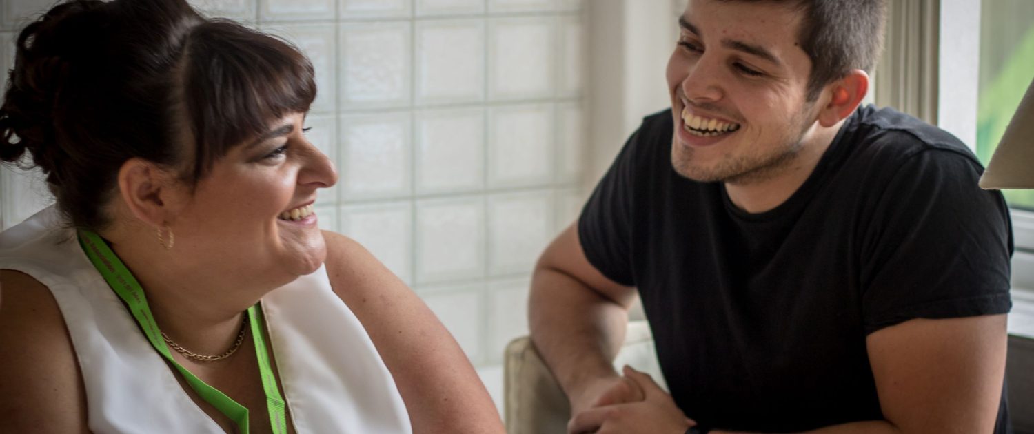 two people laughing together