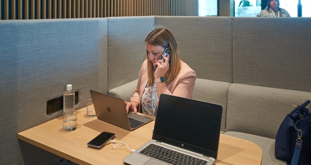 A woman on the phone in the office space