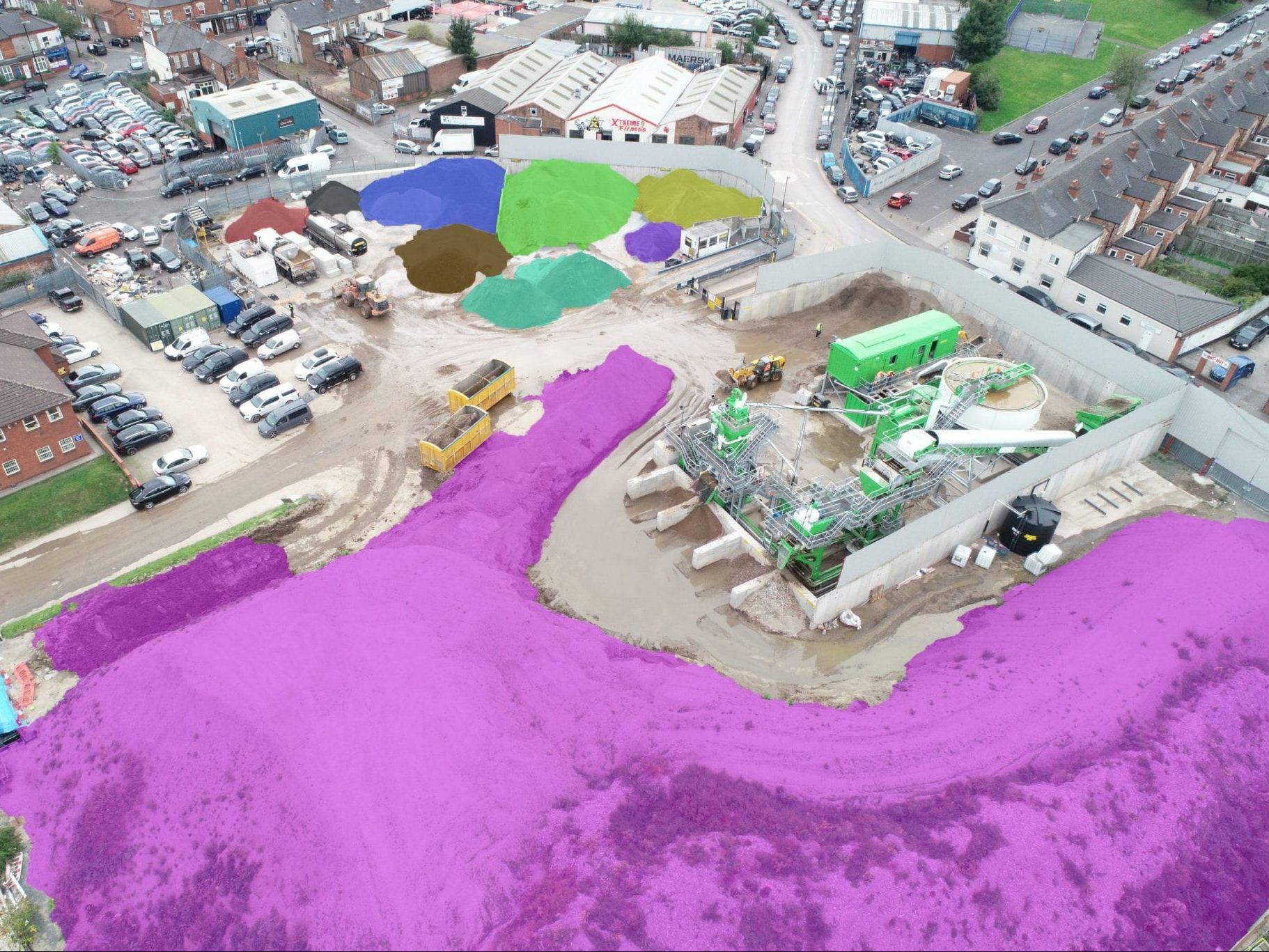 Birds eye view of a construction with certain sections highlighted in colours for 3D scanning