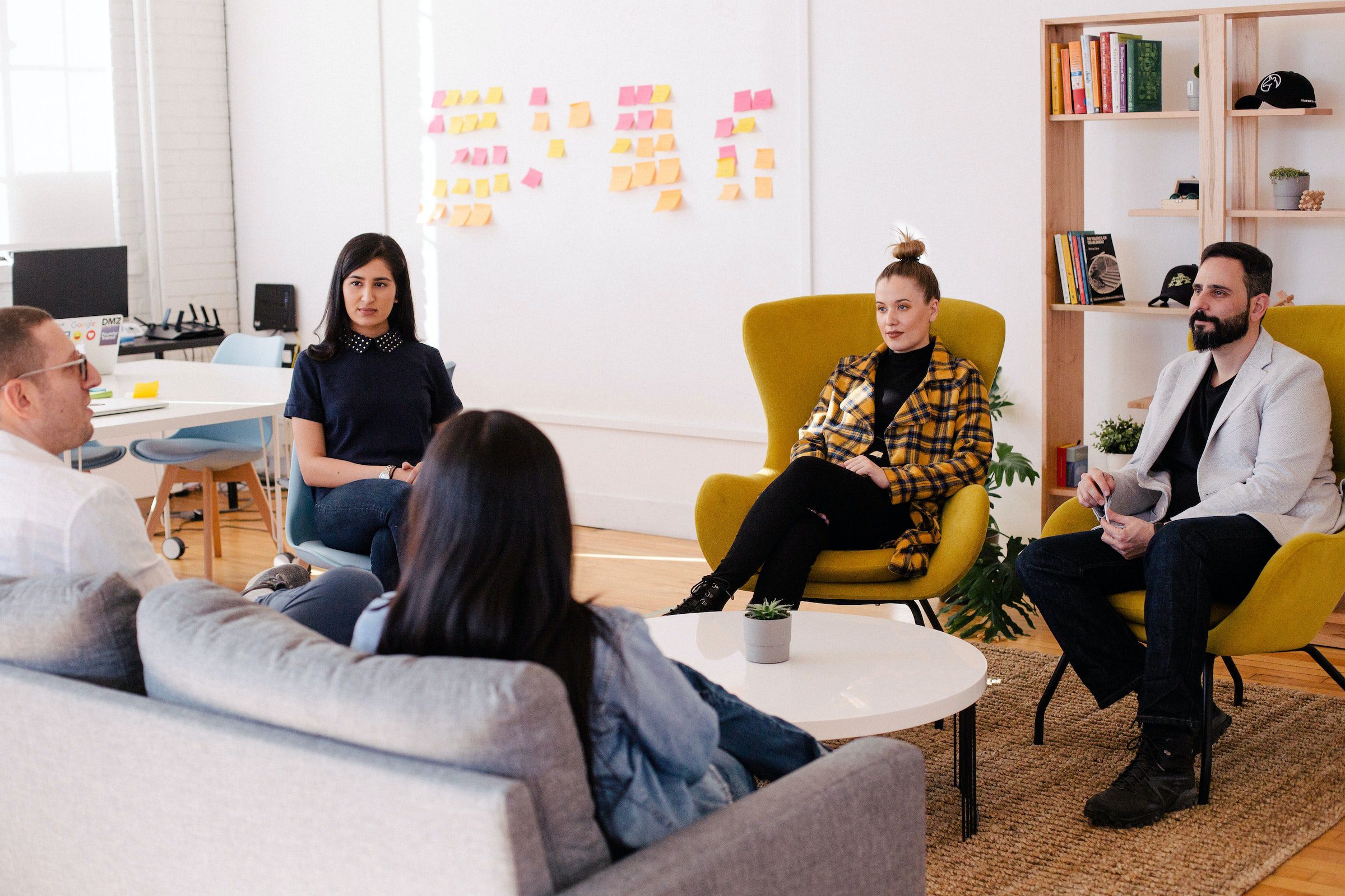 People sitting in a circle having a meeting